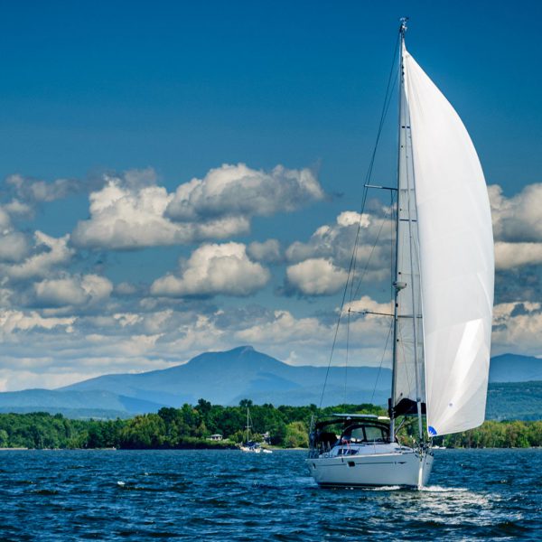 Boat sailing in Lake Champlain in the summer time.