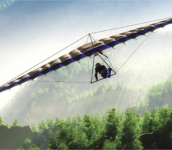 Someone Paragliding over a forest.