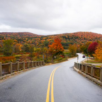 Winding road in Vermont during the fall season.