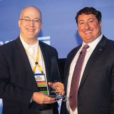 Dave Provost and Dan Towle holding a trophy.