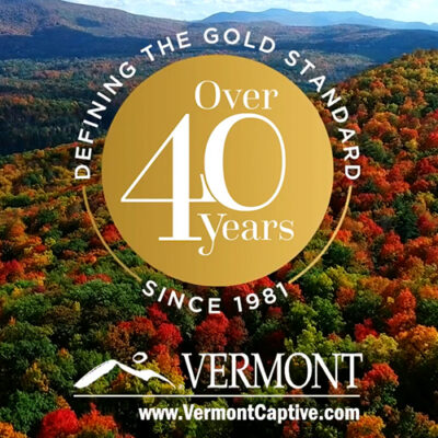 40th anniversary logo with Vermont mountains in the background